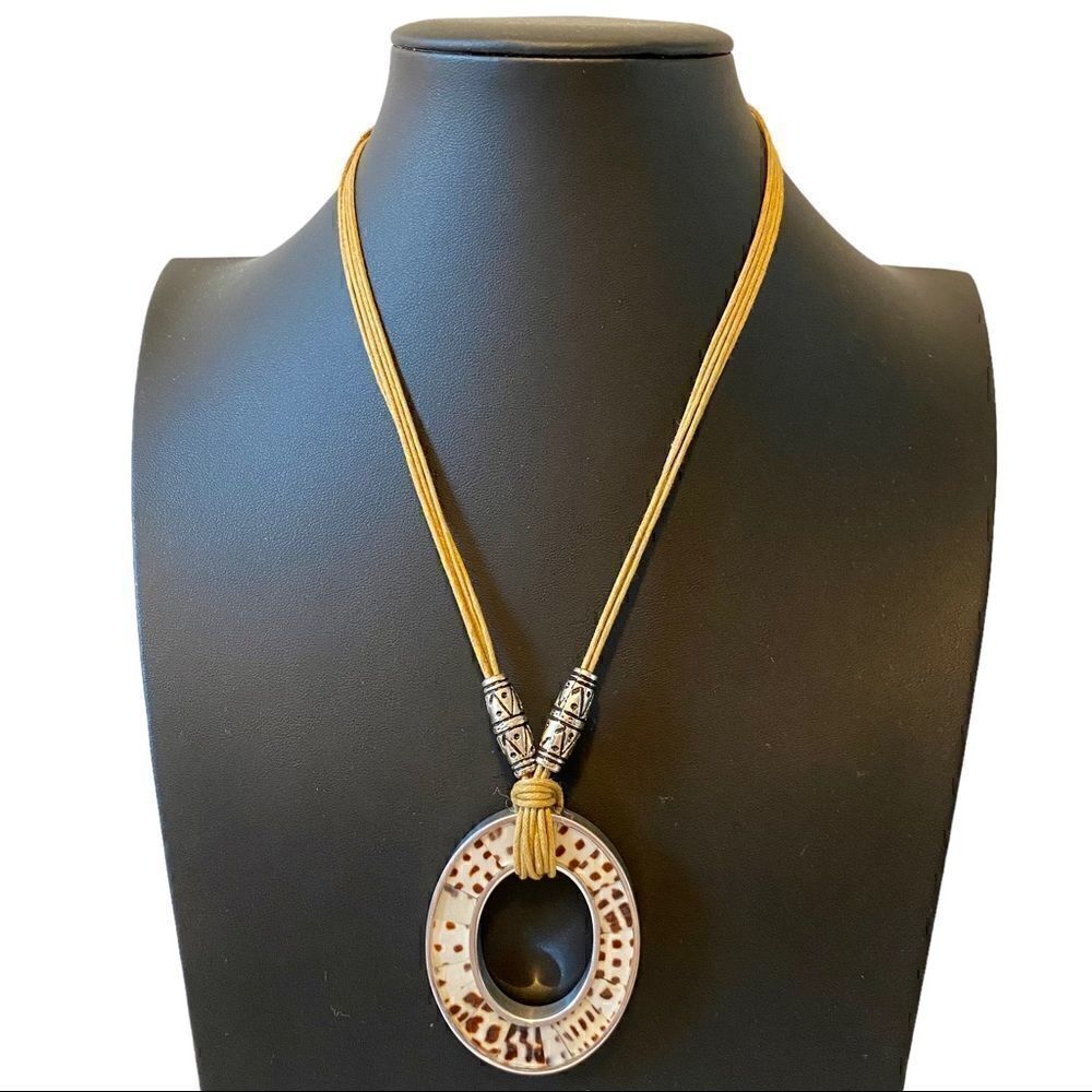Tribal Looking Pendant Necklace on light brown cord.